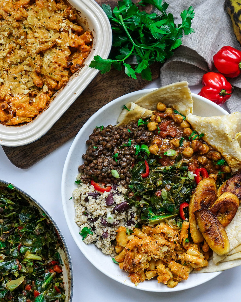 Image of a selection of Caribbean vegan dishes on a white background.